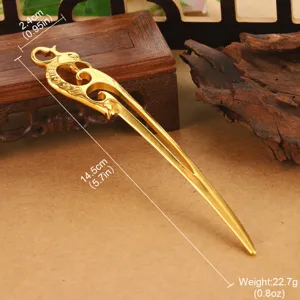 Detail view showing measurements of the golden dragon and cloud pattern vintage hairpin.