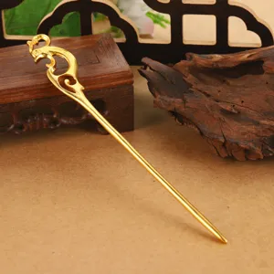 Close-up detail of elegant gold hollow dragon hairpin for traditional Hanfu hair styling