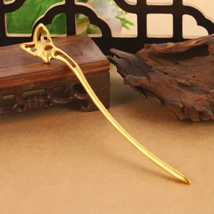 Detailed macro view of golden hollow butterfly hair stick for traditional Hanfu styling