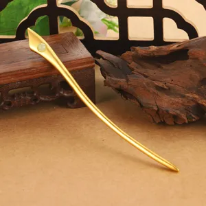 Elegant gold-colored traditional Chinese hair stick with a delicate white stone inlay detail