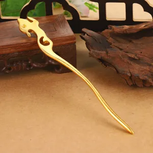 Close-up detail of hollow golden dragon hairpin, elegant ancient style Hanfu hair accessory.
