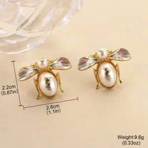 Close-up of enamel bee pearl earrings with size and weight measurements in inches and grams.