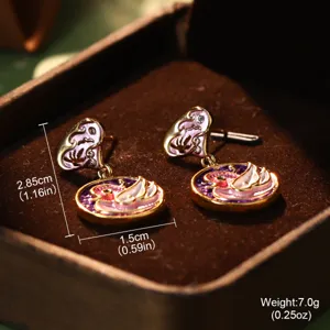 Detail of enamel swan heart drop earrings showing 2.85cm height and 7g weight specs
