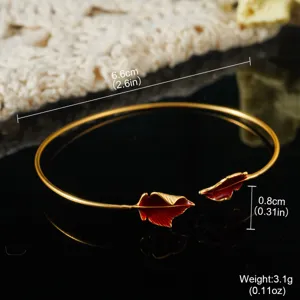 Vintage gold-plated cuff bracelet featuring red enamel leaf charms with dimensions