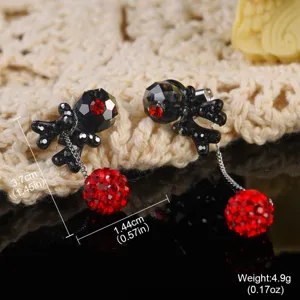 Macro detail of vintage court style earrings showing 3.7cm length and red crystal drop.