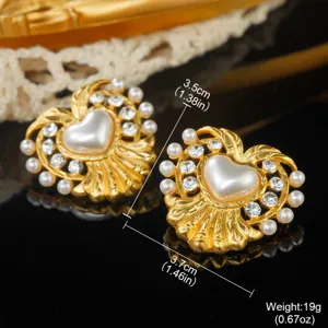 Close-up of vintage heart earrings with pearls and rhinestones showing dimensions