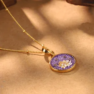Detailed close-up of a vintage Chinese style golden necklace with a purple lotus pendant