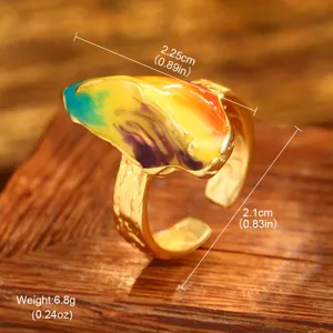 Detailed macro view of vintage oil painting style ring with colorful enamel inlay