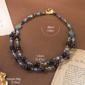 Detail view of vintage beaded necklace with gold camellia clasp and measurements