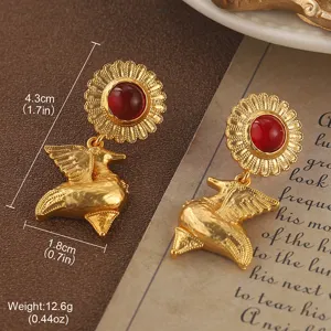 Detailed macro view showing the size of vintage gold sunflower bird earrings