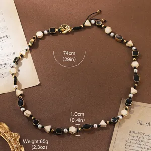 Close-up detail of vintage contrast natural stone and pearl necklace with 74cm length