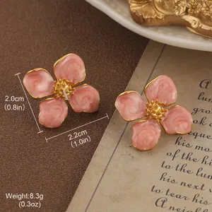 Detail view of vintage pink enamel flower earrings with size and weight measurements.