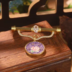 Exquisite macro detail of vintage palace style floral enamel brooch with crystal accents
