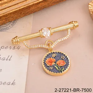 Vintage gold-tone brooch with birth flower enamel charm and clear crystal detail