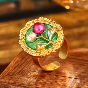 Macro view of vintage Baroque oil painting flower ring with natural pearls on wood