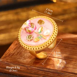 Vintage oil painting style flower ring with pearl accent shown on wooden display box