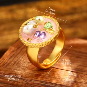 Close-up of vintage baroque ring with natural pearls and floral oil painting design