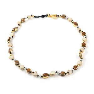 Elegant vintage pearl necklace featuring natural stone beads and gold-plated hardware choker