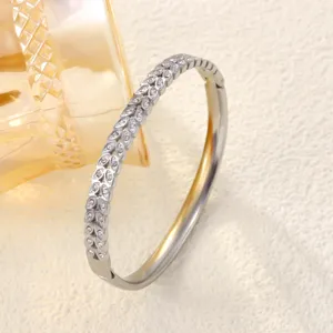 Detailed view of stainless steel bangle featuring an elegant crystal wheat ear pattern
