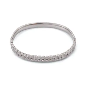 Elegant stainless steel hinged bangle featuring a crystal-set wheat ear pattern in silver