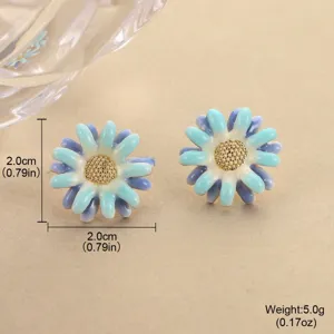 Close-up detail view of gradient blue enamel flower stud earrings with size annotations