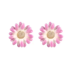 Detailed view of pink enamel flower stud earrings with golden textured centers