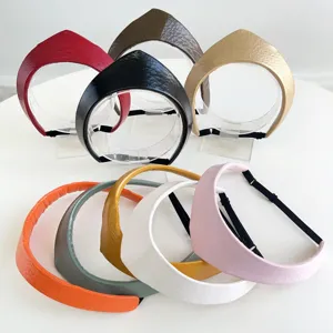 Collection of vintage-style leather crown headbands in multiple vibrant colors.