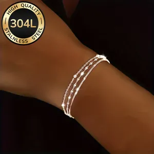 Close-up detail of high quality silver 304L stainless steel triple-layer lip chain bracelet