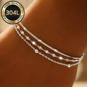 Close-up of 304L stainless steel layered bracelet with lip chain and bead details