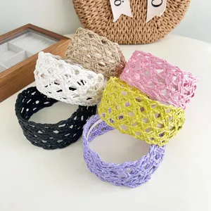Detail showing variety of multi-color woven headbands with straw texture for summer