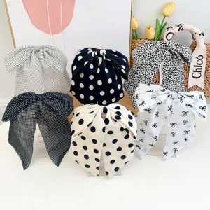 Élégantes pinces à cheveux à gros nœud en tissu avec pois et motifs léopard.