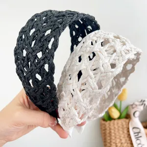 Detailed shot of textured black and cream wide woven headbands for summer vacation
