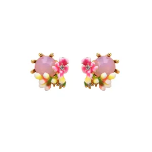 Detailed view of pink enamel flower stud earrings with crystals in a retro design.