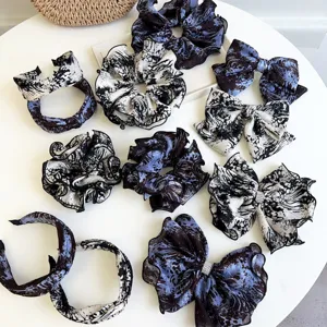 Tie-dye hair accessory set featuring headbands, scrunchies, and elegant bow clips.