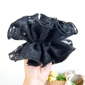 Elegant black lace oversized scrunchie hair tie with floral pattern for bun styling