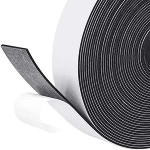 Close-up of black self-adhesive felt tape showing protective white backing layer.