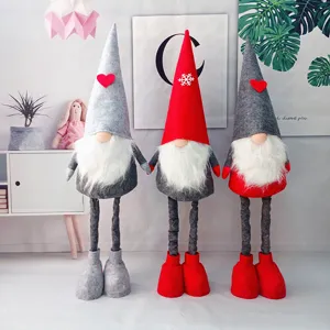 Set van drie kerstkabouters met telescopische poten voor feestelijke huisdecoratie nu.
