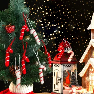 Detail view of handmade wool felt candy cane ornaments on a festive Christmas tree