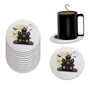 White Halloween felt coasters featuring haunted house print and a black mug prop.