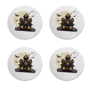 Set of four circular white felt coasters with Halloween haunted house print.