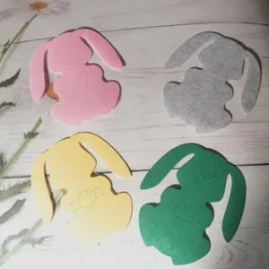 Four color Easter bunny felt cutlery holder set for festive holiday table decoration.