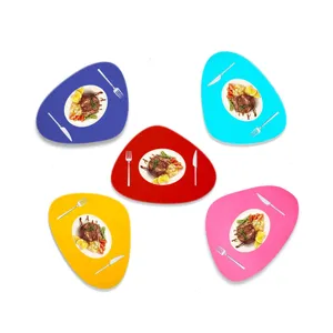 Detail view of irregular pebble-shaped felt placemats in five vibrant color options