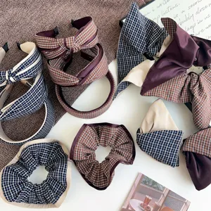 Macro view of assorted plaid knotted headbands and scrunchies in cozy autumn brown