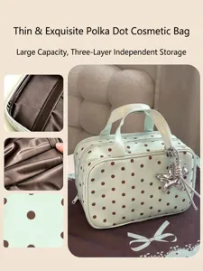 Waterproof polka dot cosmetic bag with large capacity and multi-layer storage design.