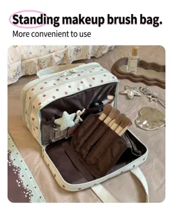 Polka dot makeup bag with large capacity, three-layer partitioned toiletry and cosmetic storage.