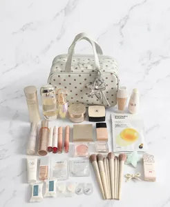 Polka dot travel cosmetic bag with multi-layer large capacity storage for toiletries and makeup.