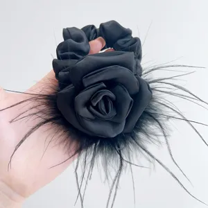 Handmade black satin scrunchie with ostrich feathers and elegant fabric camellia rose