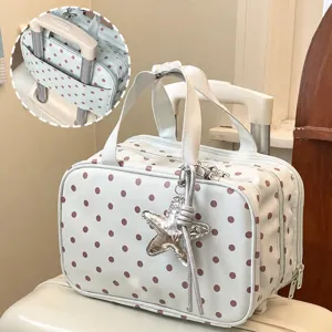 Polka dot cosmetic bag with luggage strap, multi-layer toiletry bag and large travel storage bag.