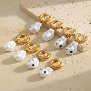 Detailed view of 18K gold-plated hoop earrings with baroque pearls and colorful crystals.