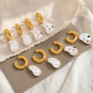 Detailed close-up view of baroque pearl hoop earrings with colorful rhinestone accents
